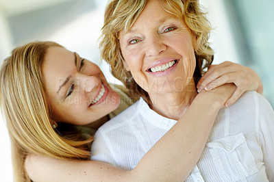 Buy stock photo Portrait, mature mom and daughter embrace in home with morning bonding, smile and care in living room together. Relax, senior mother and girl with happy face for love, hug and support in apartment