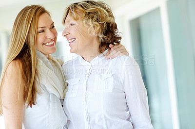 Buy stock photo Happy, mature mother and daughter with hug at house for love, family support and bonding together. Smile, women and mom with embrace for relationship, trust and connection growth of carefree weekend