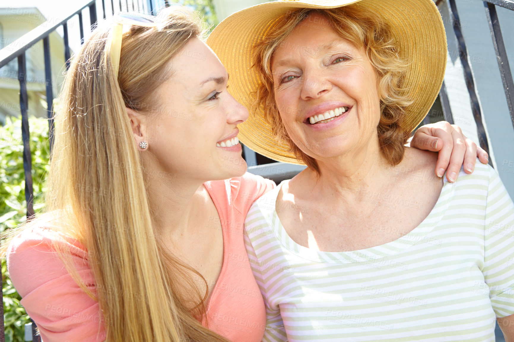 Buy stock photo Stairs, senior mother and daughter with happiness for love, support and relax in Germany. People, parent and smile outside at home for summer holiday, break and nature for bonding and respect