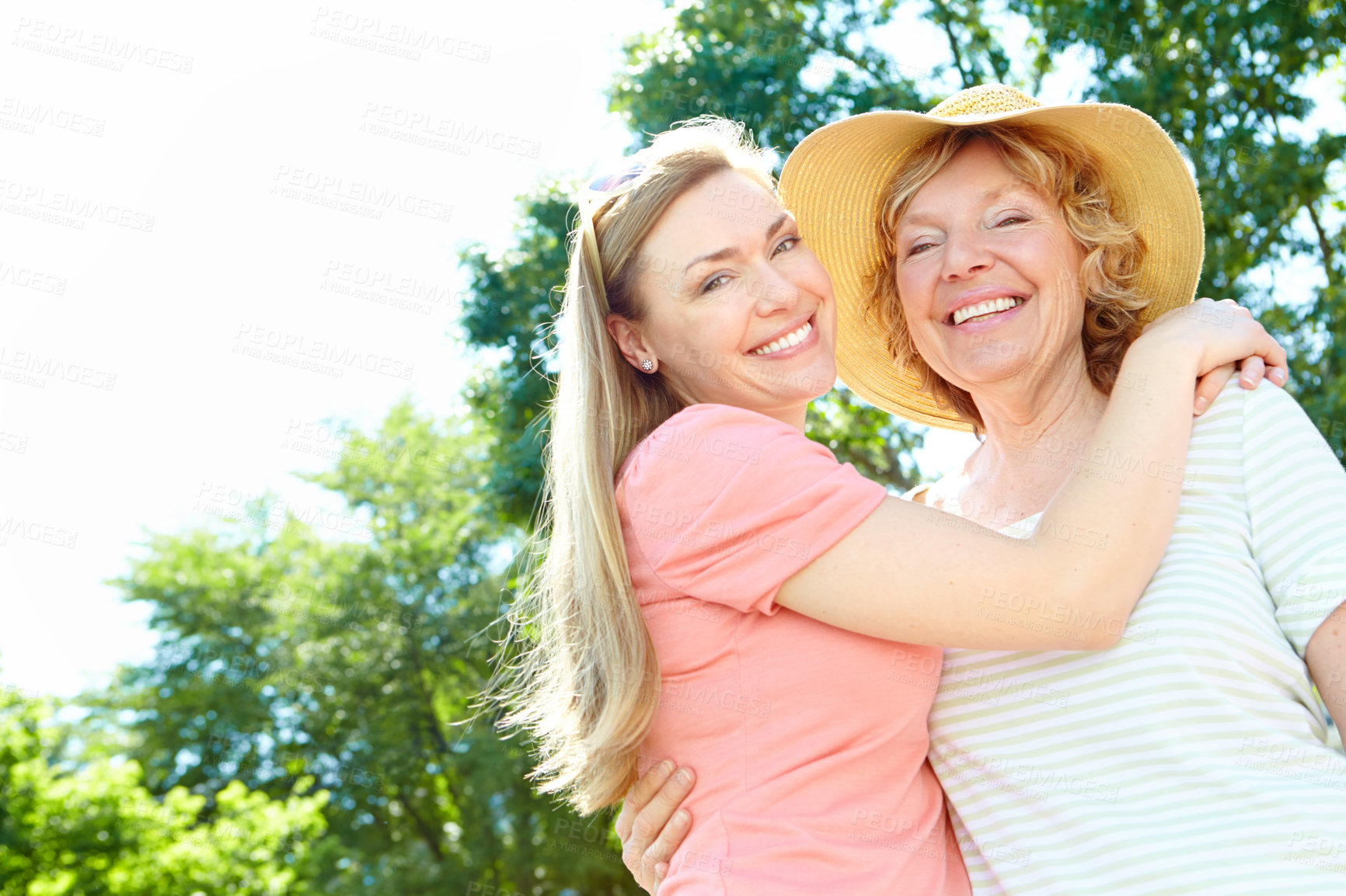 Buy stock photo Portrait, mature mother and daughter in garden with morning bonding, smile and fun embrace together. Love, senior mom and girl with happy face for hug, care and relax in backyard with mockup space