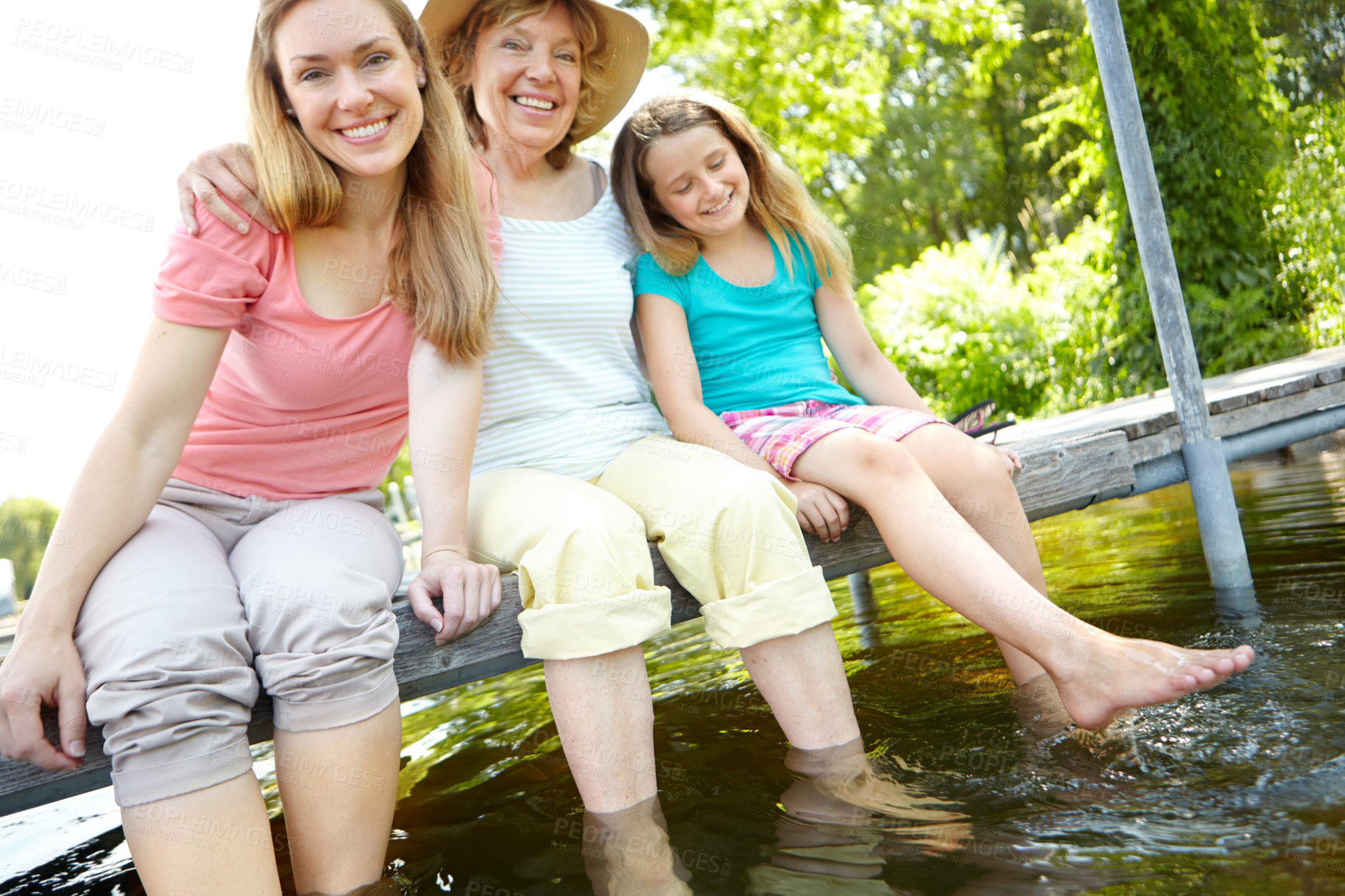 Buy stock photo Portrait, lake and mother with daughter, generations and vacation with water, happiness and relax. Face, family and parent with weekend break, bonding together and love with summer holiday and joyful