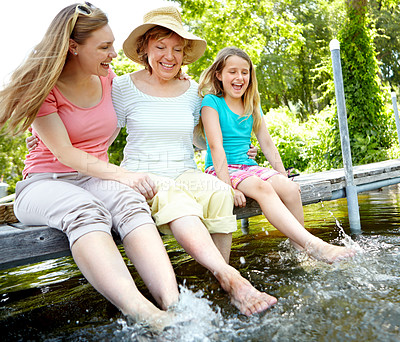 Buy stock photo Happy family, grandmother and child with splash in water for relax on holiday or vacation in river. Senior woman, daughter and kid in bonding together for love, support and care as generations in USA