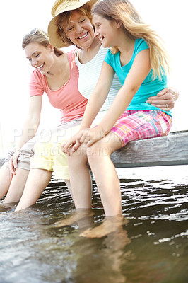 Buy stock photo Happy family, senior woman and child with playing in water for relax, holiday and vacation in river. Grandmother, daughter and kid in bonding together for love, support and care as generations in USA