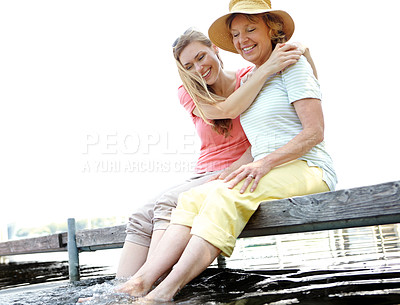 Buy stock photo Lake, senior mom and daughter with happiness for love, support and relax in Germany. People, parent and laughing outdoor on water dam sky for holiday, break and nature for bonding and respect