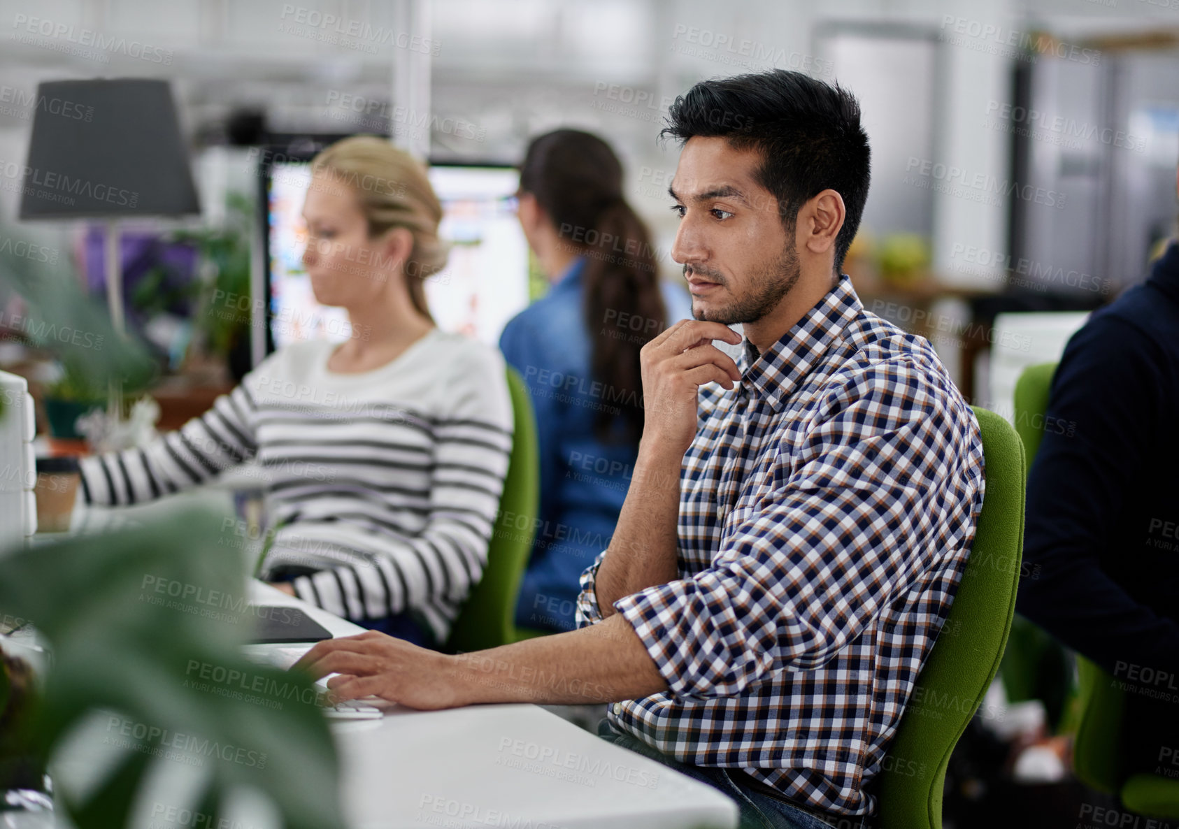 Buy stock photo Serious, businessman and thinking at desk with computer for research on company project in group workplace. Male person and employee with technology for creative idea or vision on design proposal