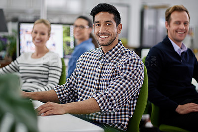 Buy stock photo Coworking, office and portrait of businessman at desk with team in cooperation on project. Confident, editor and people in collaboration with editing news, article or planning online magazine media