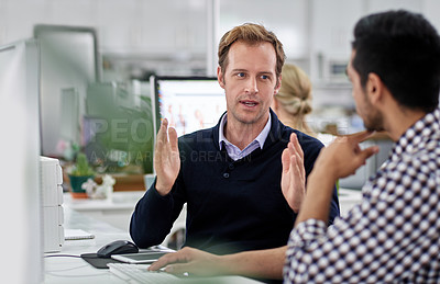 Buy stock photo Coworkers in an office discussing a project