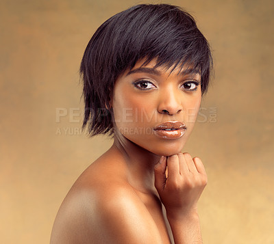 Buy stock photo Studio portrait of a beautiful young woman against a brown background