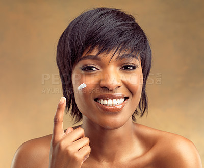 Buy stock photo Product, hand and portrait of black woman for beauty, skincare and cosmetics isolated on brown background. Happy, face and gen z girl for self care, dermatology and natural shine on studio backdrop