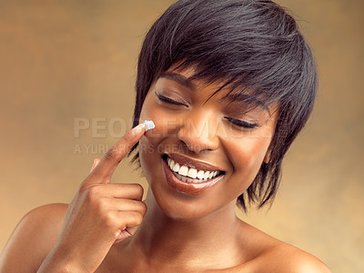 Buy stock photo Product, cream and smile of black woman for skincare, beauty and cosmetics on brown background. Happy, aesthetic and face of girl for self care, dermatology and natural shine on studio backdrop