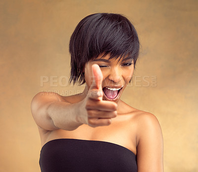 Buy stock photo Beauty, portrait and black woman with hand pointing at you in studio for accountability, choice or promo on brown background. Face, hey or model with finger gun vote for hair, donation or charity