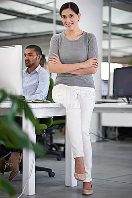 Buy stock photo Business woman, portrait and colleague working on project for management, start up and corporate. Person, coworker or employee in company sitting on desk smiling, confident and proud in office