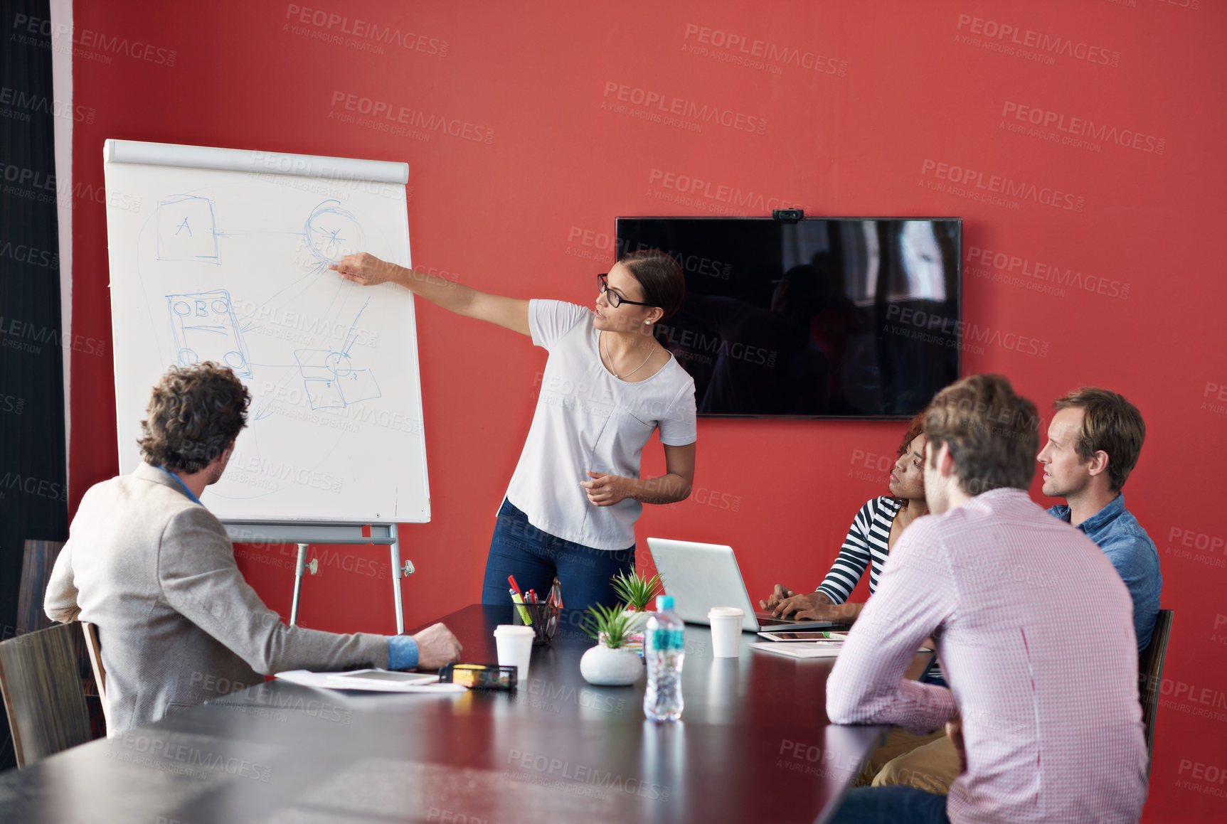 Buy stock photo Business woman, whiteboard and presentation with team in meeting for coaching in conferece at office. Female person or employee showing or training staff with flipchart for planning or discussion
