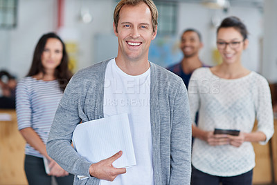 Buy stock photo Handsome mature man smiling with staff in the background