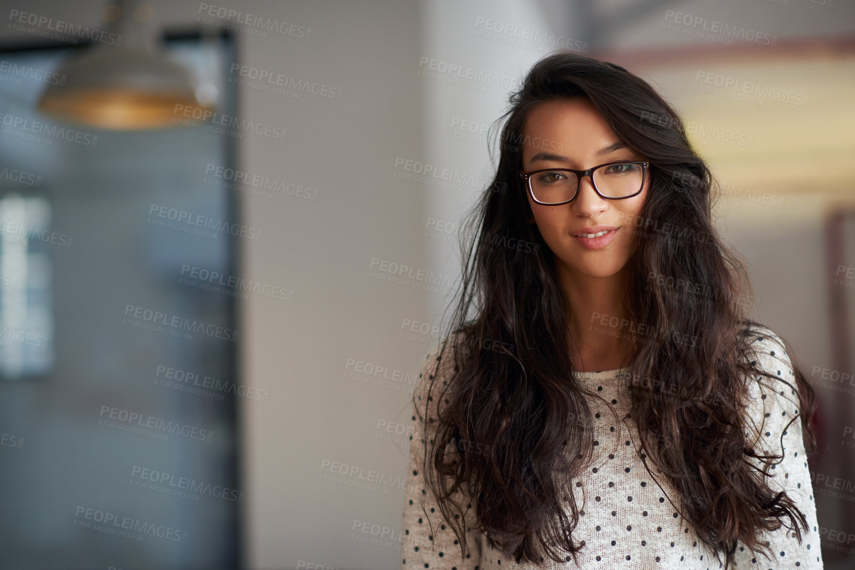 Buy stock photo Portrait of a beautiful trendy young woman in an urban creative setting