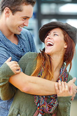 Buy stock photo Laugh, love and couple hug in city for support, care or connection for healthy relationship on holiday. Man, funny woman and embrace outdoor for romance, joke or talking to partner on date together