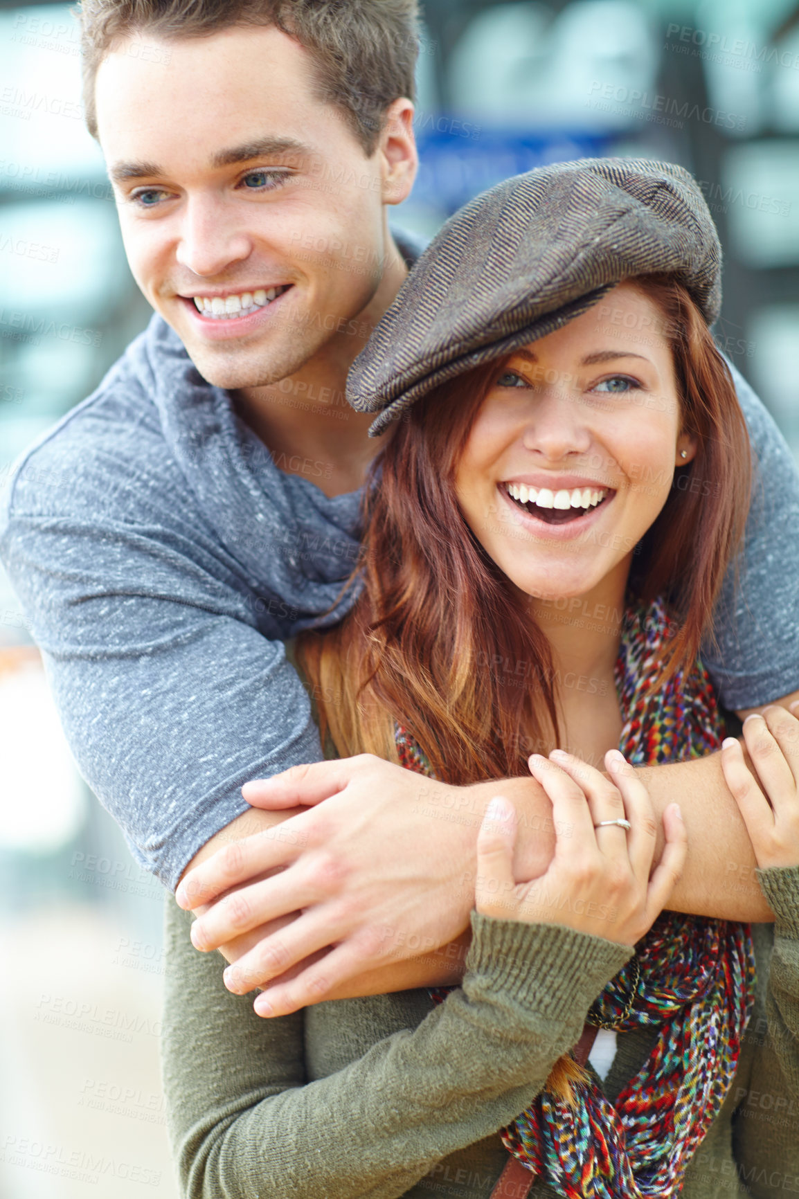 Buy stock photo A couple at a train station laughing together