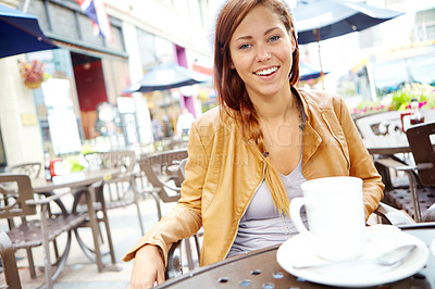 Buy stock photo Portrait of a beautiful woman sitting at an outside cafe having a cup of coffee with copyspace