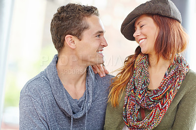 Buy stock photo Shot of a happy couple looking at each other lovingly