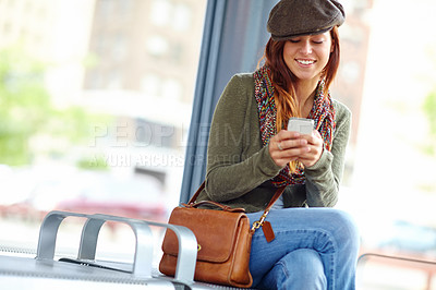 Buy stock photo Train station, smile and woman with smartphone for waiting, patience and delay of public transport. Railway, female person and traveler with mobile for schedule trip, travel details or online booking