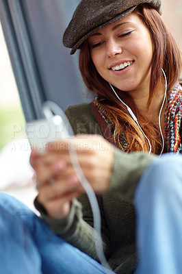 Buy stock photo Typing, smile and woman with cellphone, listening to music and contact with connection, app and joy. Person, social media and girl with smartphone, sound and audio with podcast, mobile user and relax