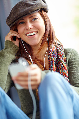 Buy stock photo Train, travel and woman with mobile for music, audio track and smile for playlist in public transport. Passenger, female person and thinking with earphones for listening, hearing and podcast joke