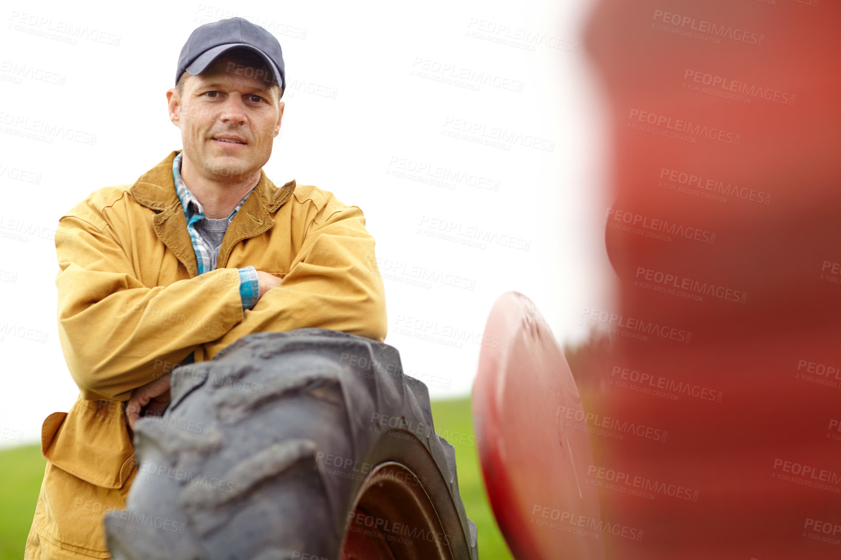 Buy stock photo Tractor, farm and portrait of man at wheel with confidence, agro industry or small business owner at harvest. Agriculture, sustainability and farmer in field with pride, land and truck in countryside