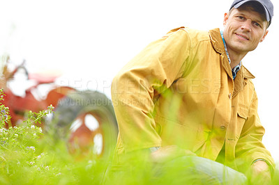 Buy stock photo Man, farming, outdoor and portrait with tractor in field for  food production with sustainability in countryside. Person, farmer and small business owner with vehicle, smile and agriculture in Spain