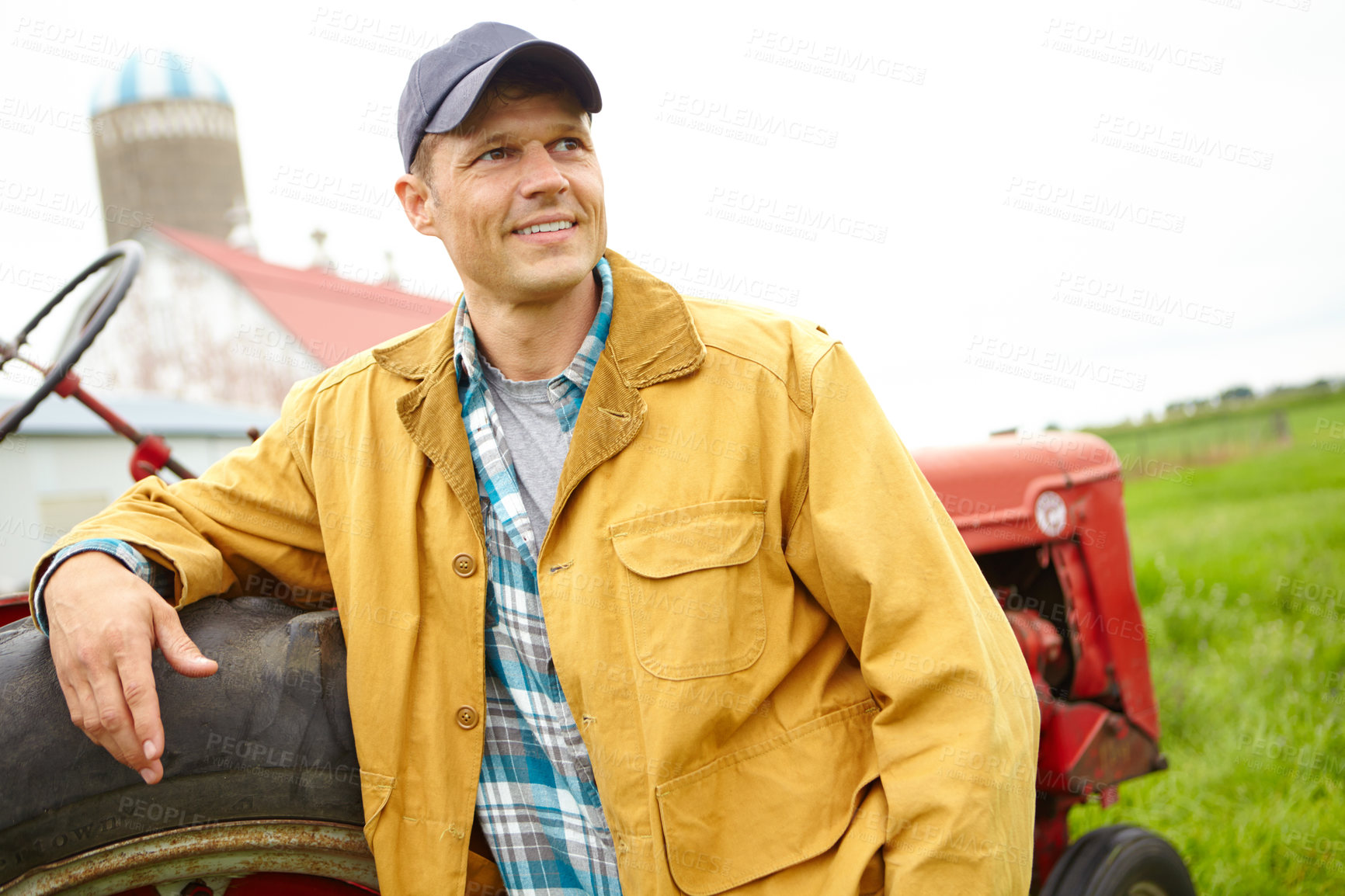 Buy stock photo Farming, thinking and man with tractor for harvesting, agriculture and tiling for cultivation on countryside. Smile, male person and farmer with machine truck for driving, planting and sustainability