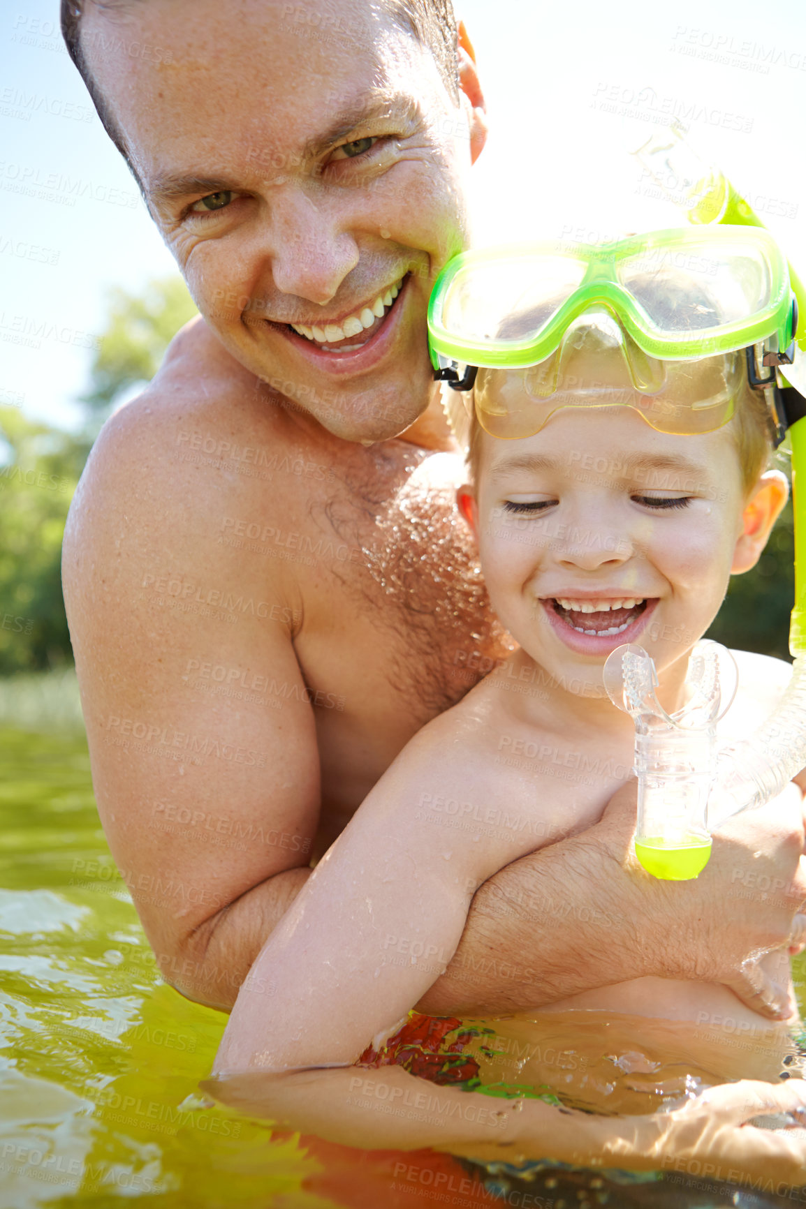 Buy stock photo Swimming, portrait and man with child in nature for outdoor bonding, activity and learning on vacation. Snorkel, goggles and father with son in lake water for holiday, teaching and weekend adventure