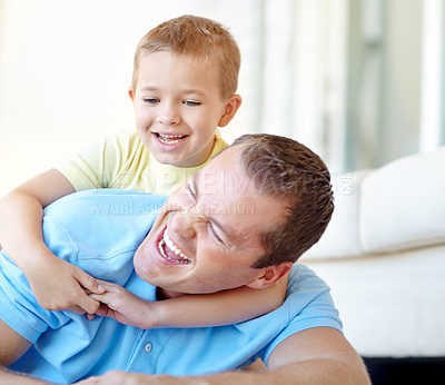 Buy stock photo Happy, father and child playing in family home with fun, bonding and love in living room. Smile, wrestle and youth with parent care, support and laugh from game with hug and embrace on the floor