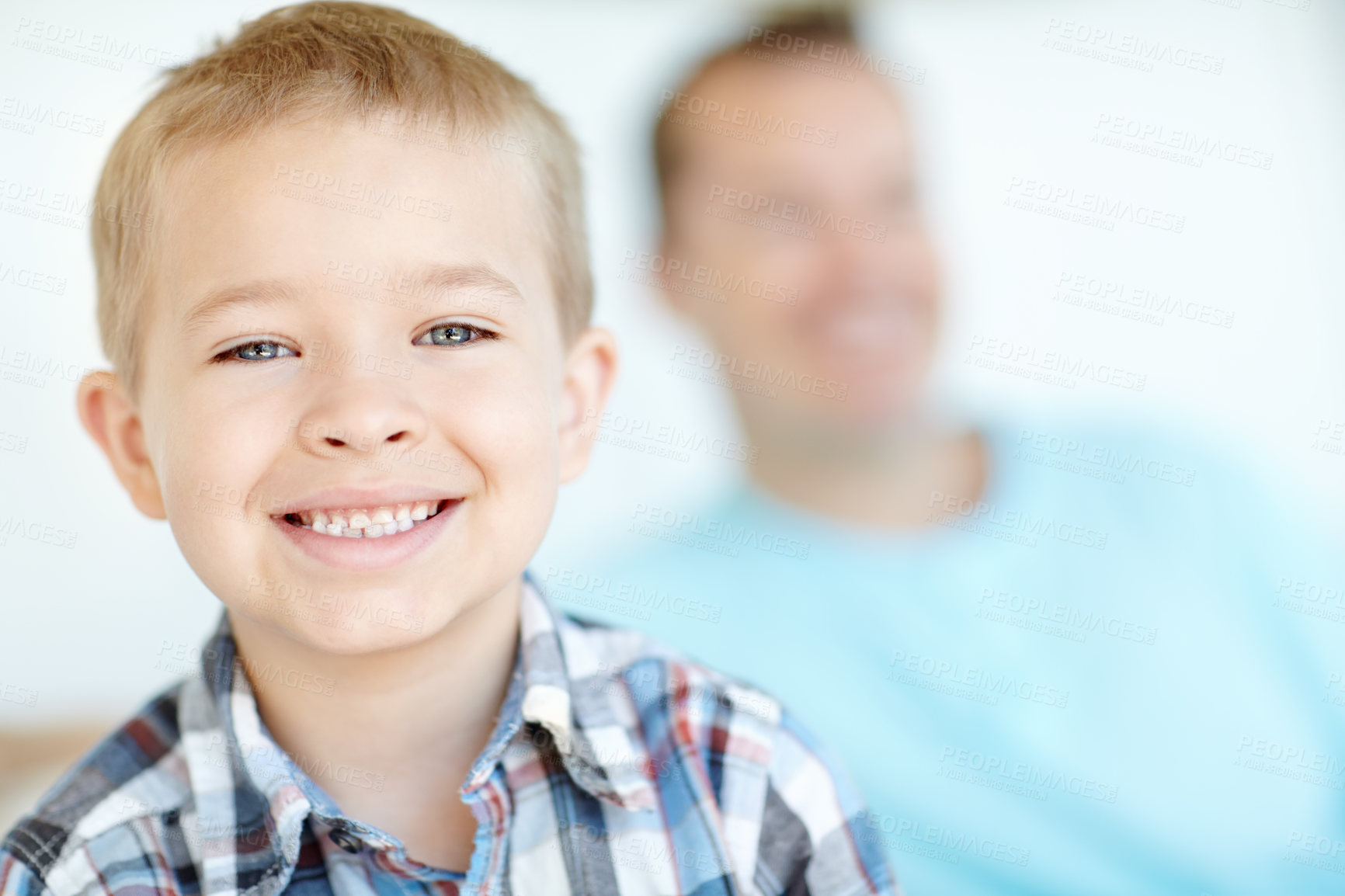 Buy stock photo Smile, portrait and boy on couch with dad for weekend fashion, confidence and fun bonding together in home. Happy, face and kid on sofa with playful development, growth and cool style for children