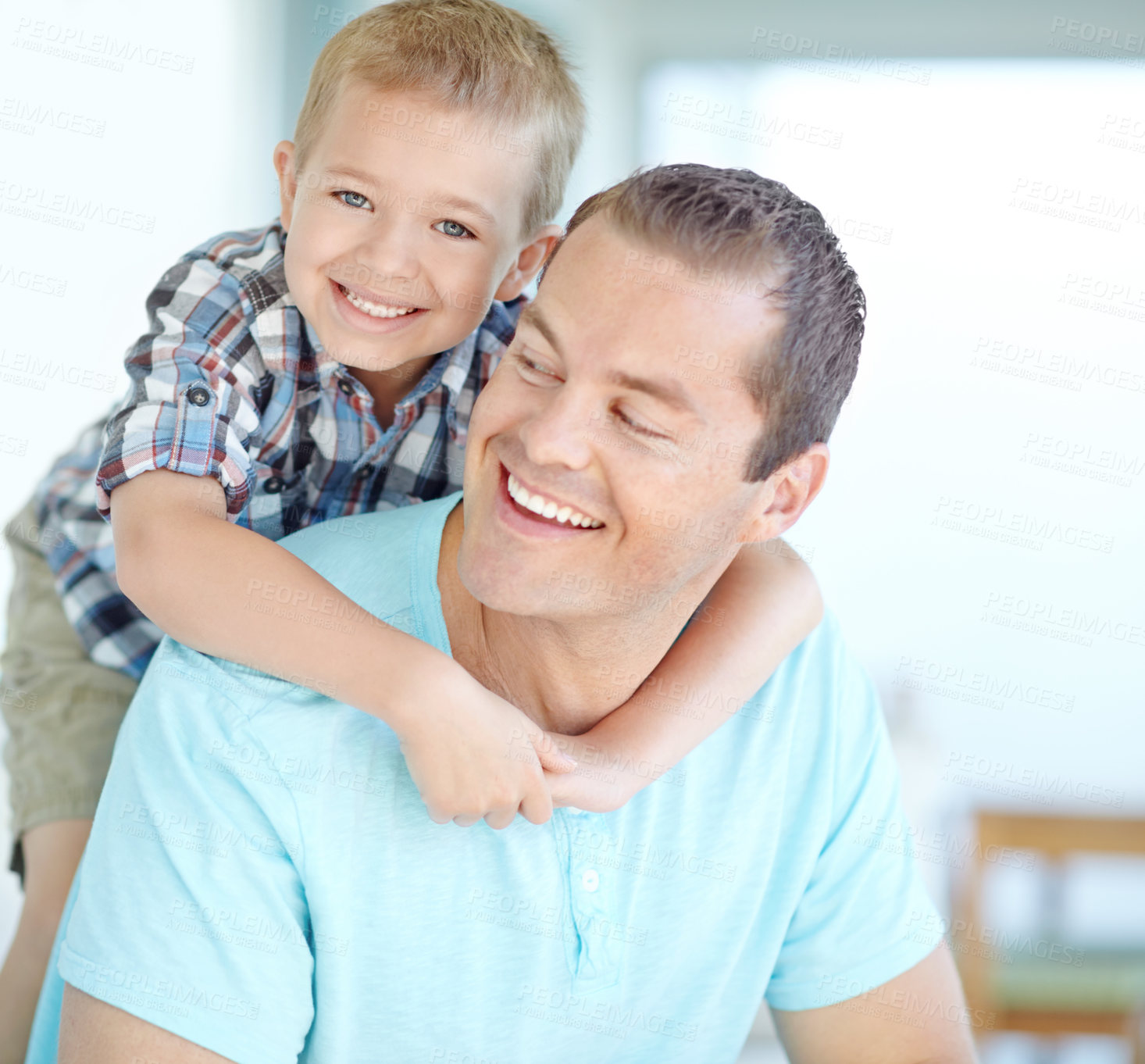 Buy stock photo Boy, father and piggy back in portrait in home with smile, bonding and love for games, funny or connection in morning. Child, dad and happy with comic memory, hug and care at family house in Germany