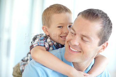 Buy stock photo Happy, father and child hug in family home with fun, bonding and love in living room. Smile, play wrestling and youth with parent care, support and together with game, embrace and piggy back