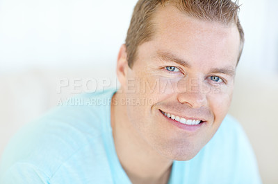 Buy stock photo Excited, relax and portrait of man in home with positive attitude, chilling or resting in living room. Happy, calm and face of person from Germany with confidence and pride in lounge at apartment.