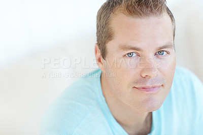 Buy stock photo Happy, chill and portrait of man in home with positive attitude, relaxing or resting in living room. Smile, calm and face of male person from Germany with confidence and pride in lounge at apartment.