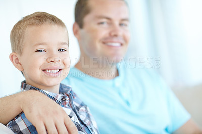 Buy stock photo Portrait, father and son relax at house for safety, bonding together and love of relationship care. Happy, man and child with calm morning, weekend break and family support for embracing at apartment