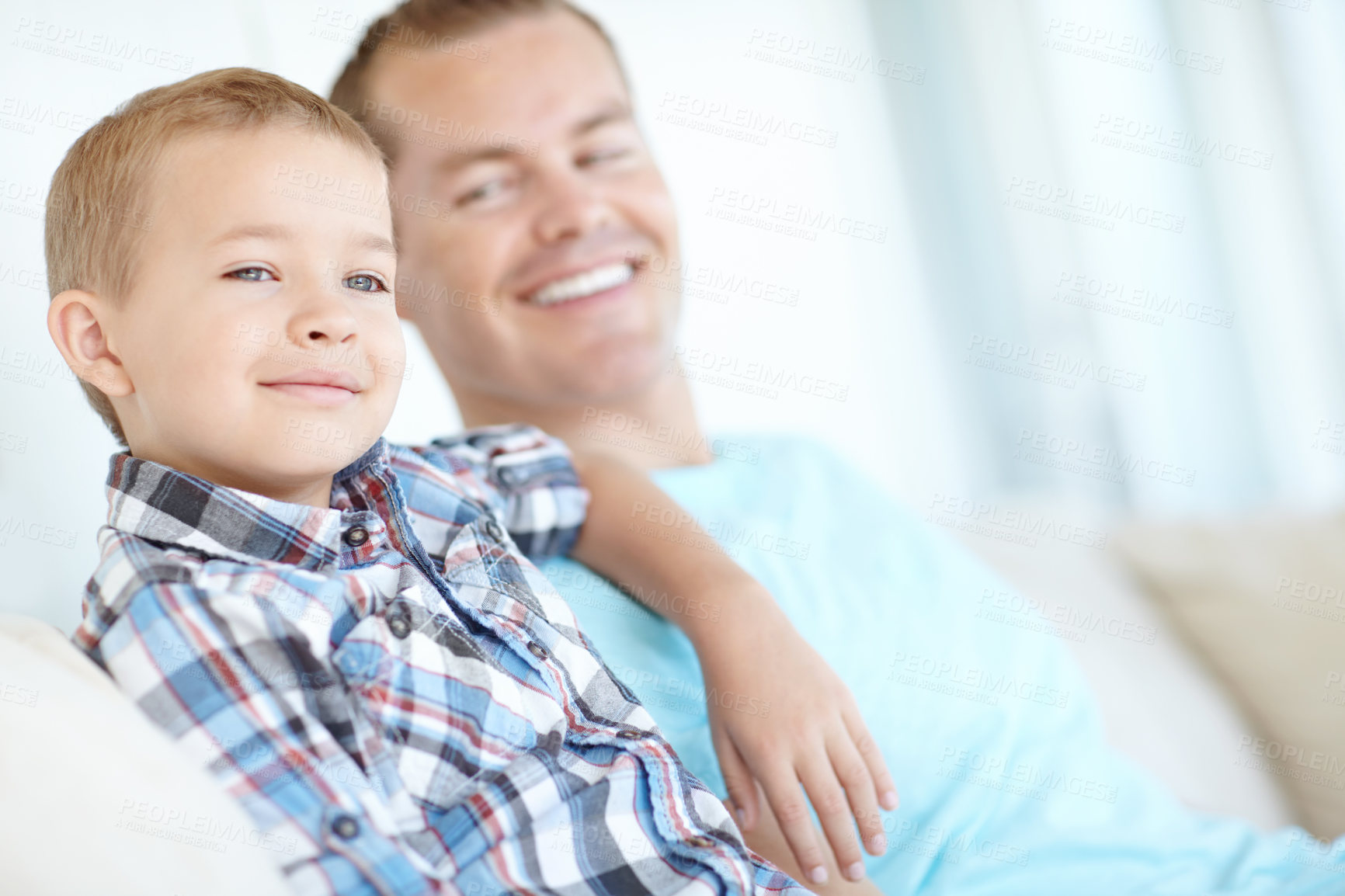 Buy stock photo Thinking, dad and son relaxing at house for safety, bonding together and love of relationship care. Happy, man and child with calm morning, weekend break and family support for embracing at apartment