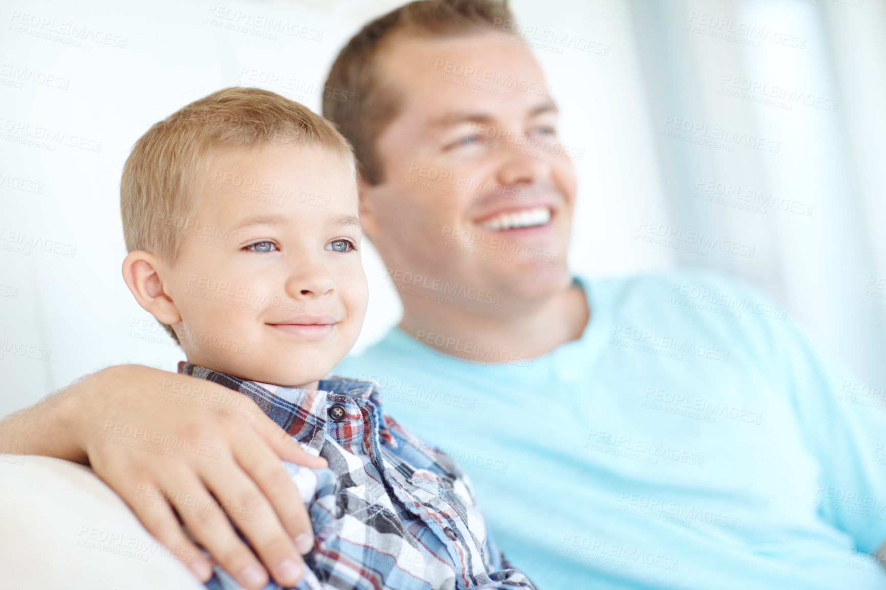 Buy stock photo Thinking, dad and child relaxing at house for safety, bonding together and love of relationship care. Happy, man and son for calm morning, weekend break and family support with embrace at apartment