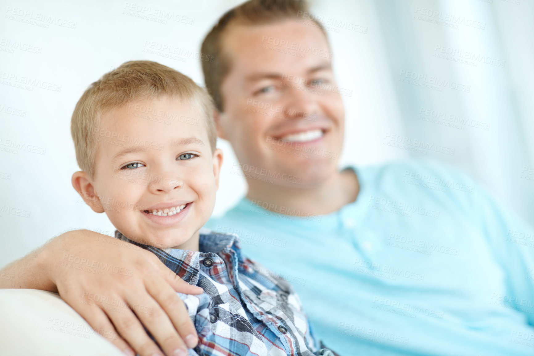 Buy stock photo Portrait, dad and child relaxing at house with safety, bonding together and love of relationship care. Happy, man and son for calm morning, weekend break and family support with embrace at apartment