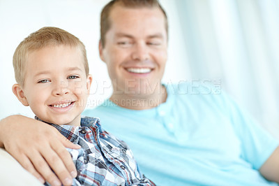 Buy stock photo Happy, dad and child relaxing at house with safety, bonding together and love of relationship care. Smile, man and son for calm morning, weekend break and family support with embracing at apartment