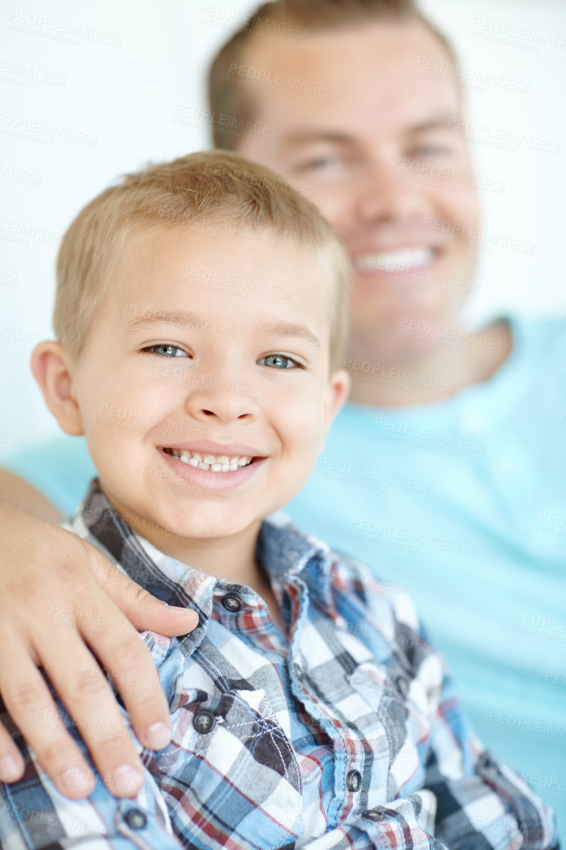 Buy stock photo Dad, child and relax with portrait at house for safety, bonding together and love of relationship. Happy, man and son for calm morning, weekend break and family support with embracing at apartment