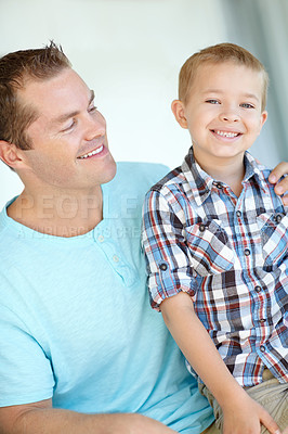 Buy stock photo Father, child and relax with embrace at house for safety, parental support and bonding together of weekend break. Smile, man and son with hug for family love, relationship care and calm morning