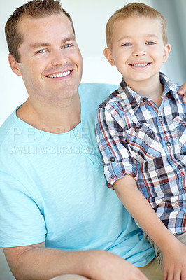 Buy stock photo Portrait, father and son relax at house with safety, bonding together and love for relationship care. Smile, man and child with calm morning, weekend break and family support for embrace at apartment