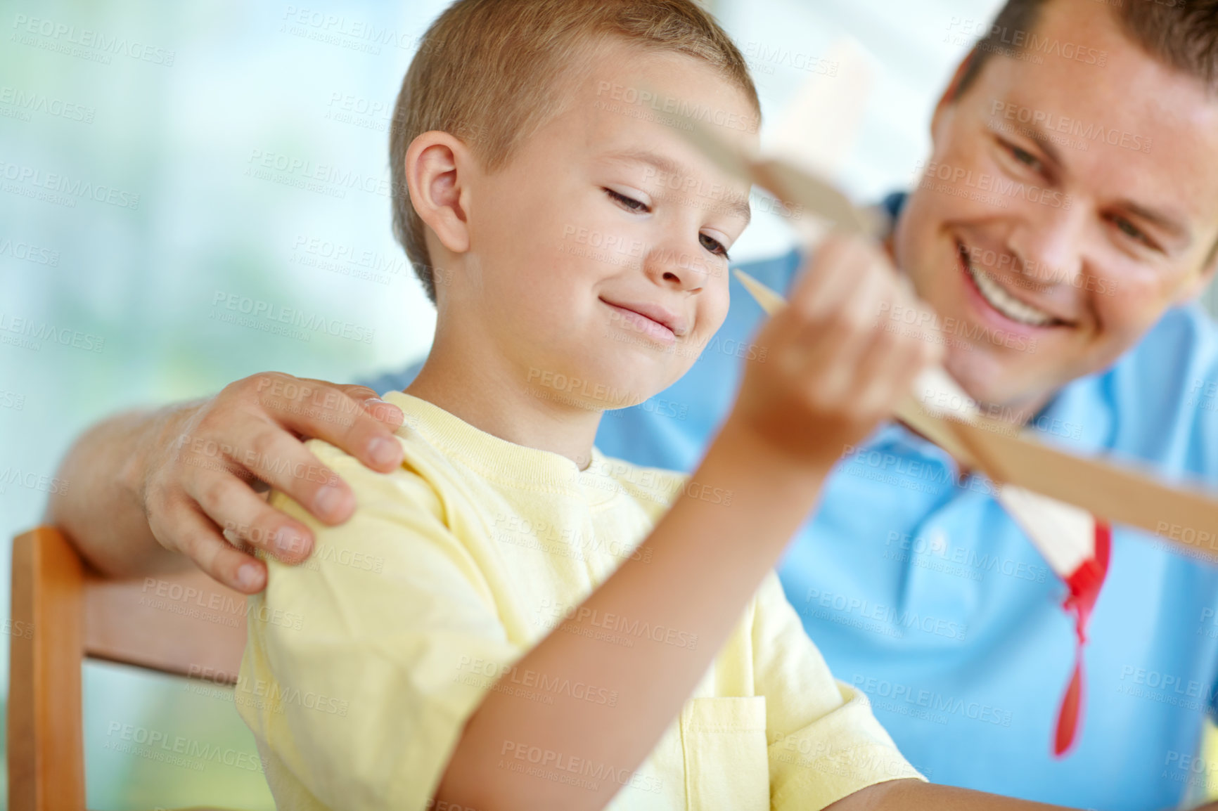 Buy stock photo Toys, boy and dad with plane, smile and fun on patio together for playful morning bonding. Playing, adventure game and happy child on porch with paper airplane, father and son in weekend home