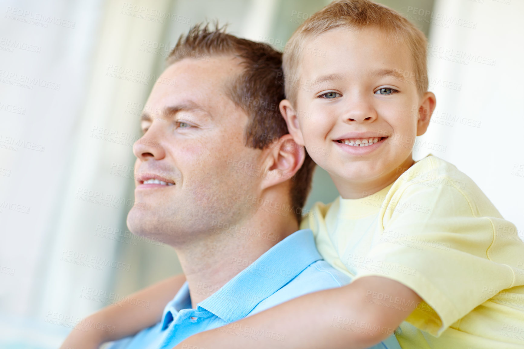 Buy stock photo Boy, dad and hug with smile for portrait in home, bonding or love with support for connection in morning. Child, dad and happy man with security, playful and piggy back at family house in France