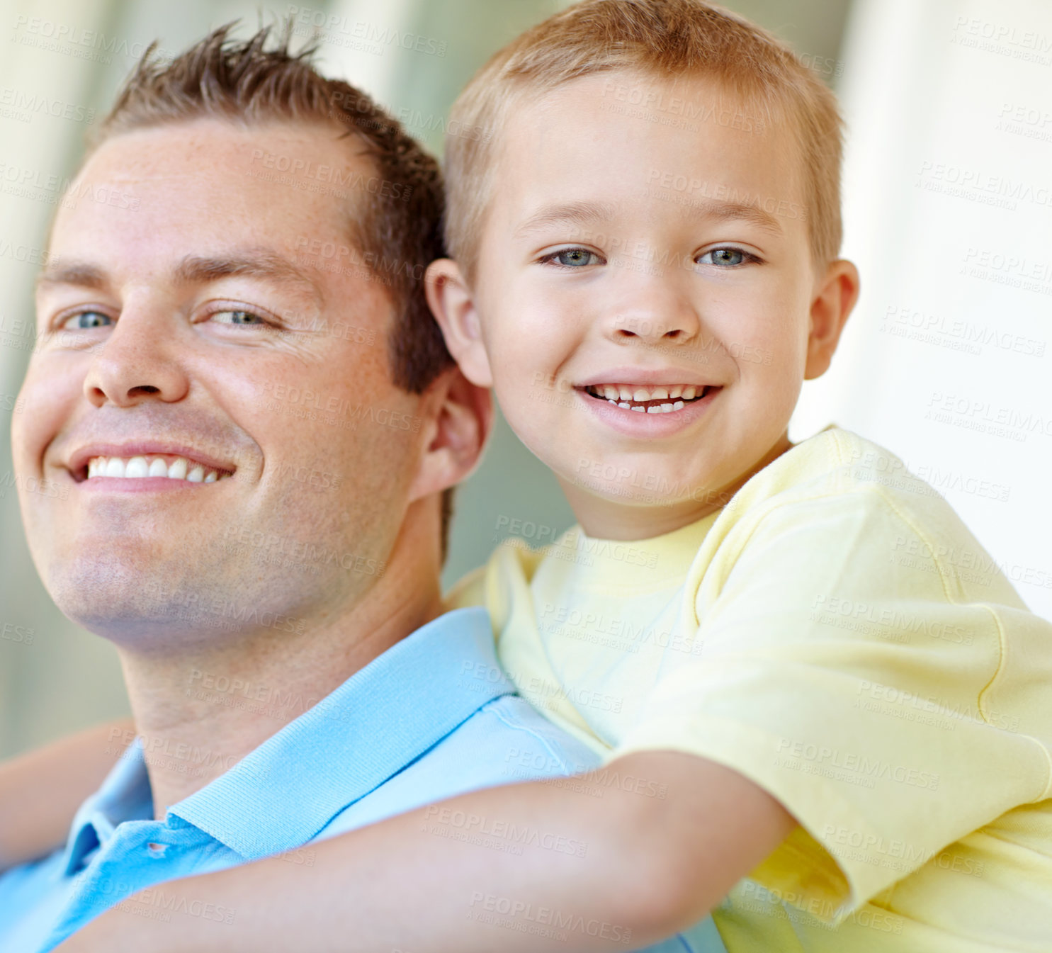 Buy stock photo Boy, dad and happy with hug in home for portrait, bonding or love with support for connection in morning. Child, dad and man with smile for security, playful and piggy back at family house in France