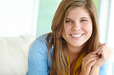 Buy stock photo Girl, portrait and teenager relax on sofa, peace and confident adolescent in living room. Female person, comfortable child and proud smile on weekend in apartment, home and morning satisfaction