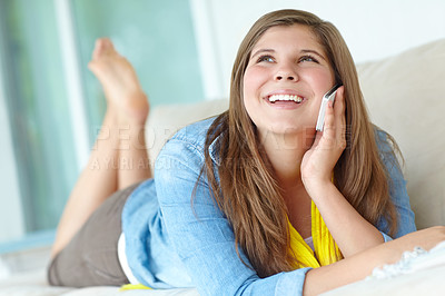 Buy stock photo Girl, phone call and teenager in home, communication and app for conversation in living room. Female person, speaking and listening to gossip story on couch, confident child and internet for talking