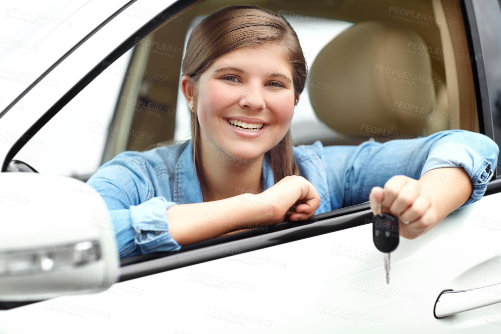 Buy stock photo Happy, portrait and girl in car with keys for purchase, investment or vehicle gift in driveway. Driver, smile and teenager from Canada by window for transport, commute or motor ownership with present